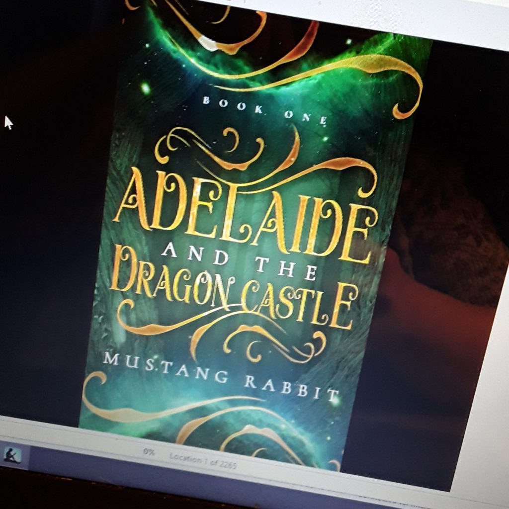 The cover of Adelaide and the Dragon Castle has gold lettering and swirls on greenish background