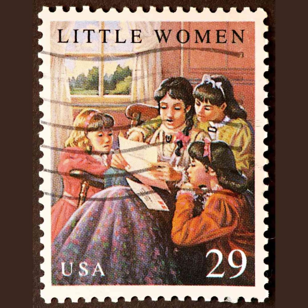 A postage stamp commemorating Louisa May Alcott's Little Women shows the four girls reading a letter.