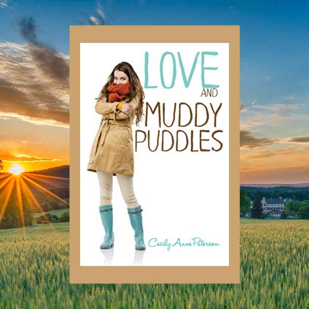 The Cover of Love and Muddy Puddles sits atop a rural scene. On the cover, a girl in a raincoat, scarf and rainboots shivers.